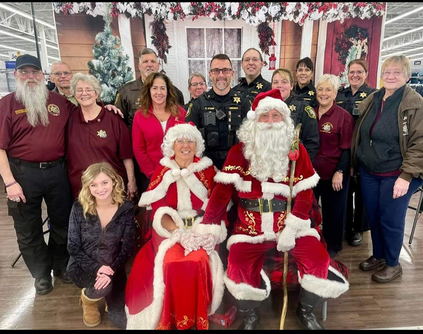 Santa and Mrs. Clause with local law enforcement